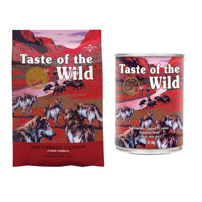 Taste of the Wild Pacific Stream Canine Formula mit geräuchertem Lachs, getreidefreie Ernährung. Verpackung zeigt Bären und Wölfe an einem Fluss vor Bergkulisse.