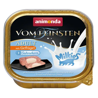 Animonda Vom Feinsten Adult s hydinou a smotanovým jadrom. Logo Milkies viditeľné. Produkt: kus mäsa s krémovou náplňou na čiernom tanieri.