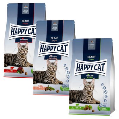 To poser Happy Cat Culinary 1+ years kattefoder. Varianter: QuellwasserFORELLE spring water trout og AtlantikLACHS atlantic salmon. Billede af kat, synlige foderpiller og ingredienser.