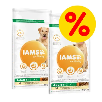 Two bags of IAMS for Vitality Adult 1+ with fresh chicken, 12kg each, showing key features and a large percentage discount symbol in yellow and red. Two bags of IAMS for Vitality Adult 1+ with fresh chicken, 12kg each, showing key features and a large percentage discount symbol in yellow and red.
