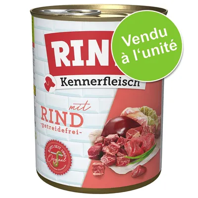 Boîte de nourriture pour chien Rinti Kennerfleisch mit Rind, getreidefrei, vendu à l’unité. Morceaux de viande de bœuf visibles sur l’étiquette.
