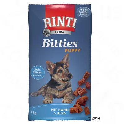 Embalagem de Rinti Extra Bitties Puppy, 75 g, com texto visível: Soft Sticks & Omega 3, Mit Huhn & Rind. Pedaços de snack castanhos ilustrados ao lado.