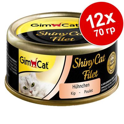 Консерва GimCat ShinyCat Filet, вкус курица, 12×70 г. Видна надпись: 100% Natural, без добавок. На упаковке изображение белой кошки.