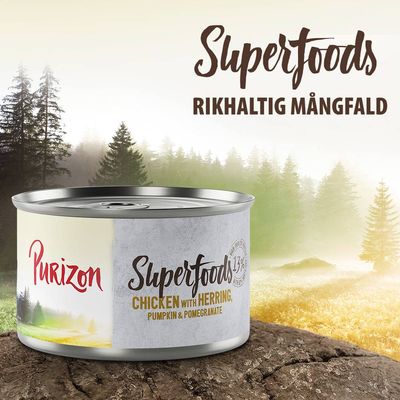 Purizon Superfoods burk, text: Chicken with Herring, Pumpkin & Pomegranate. Superfoods Rikhaltig Mångfald synligt ovanför burken.