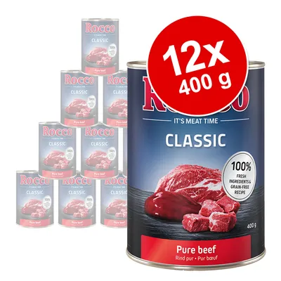 Rocco Classic Pure beef, 12×400 g. Text: 100% fresh ingredients & grain-free recipe, Pure beef, 400 g. Zobrazeno dvanáct konzerv s hovězím masem.