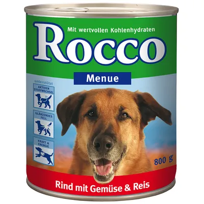 Lata de comida para cão Rocco Menue, 800 g. Texto visível: 'Rind mit Gemüse & Reis'. Inclui ícones com texto em alemão sobre metabolismo ativo, pelo brilhante e energia.