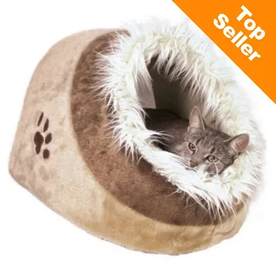 Mačka leží v hnedom plyšovom pelechu s bielym chlpatým lemom, na boku je odtlačok labky. Oranžový roh s textom Top Seller.