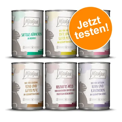 MjAMjAM-kissanruokapurkit, 6 eri makua. Oikeassa yläkulmassa oranssi ympyrä, jossa saksankielinen teksti: Jetzt testen!