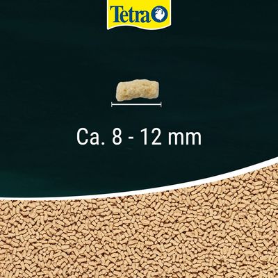 Tetra brand, single pellet with size guide showing approx. 8–12 mm, background of many similar pellets.