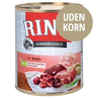 Rinti Kennerfleisch dåse med teksten 'MIT RIND', 'UDEN KORN' og 'noch mehr natürliche Fleischstücke'. Billede af oksekød og indmad på etiketten.
