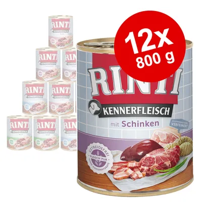 Rinti Kennerfleisch mit Schinken, 12 x 800 g tins. Large can in front with meat images and visible text: Getreidefrei, Fleisch pur, ohne Kohlenhydrate. Other Rinti cans in background. Rinti Kennerfleisch mit Schinken, 12 x 800 g tins. Large can in front with meat images and visible text: Getreidefrei, Fleisch pur, ohne Kohlenhydrate. Other Rinti cans in background.