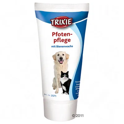 Tuba Trixie Pfotenpflege mit Bienenwachs, na embalaži sta slika psa in mačke ter besedilo Art.-Nr. 2571. Besedilo v nemščini.
