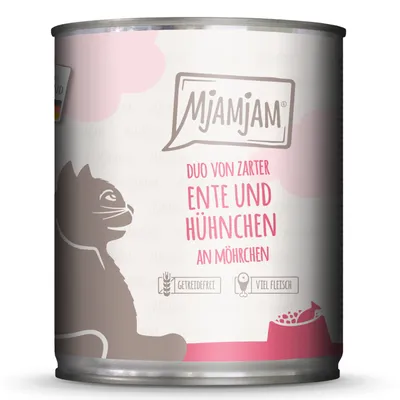 Boîte MjAMjAM, texte visible : Duo von zarter Ente und Hühnchen an Möhrchen, icônes Getreidefrei et Viel Fleisch, illustration de chat et gamelle. Texte en allemand.