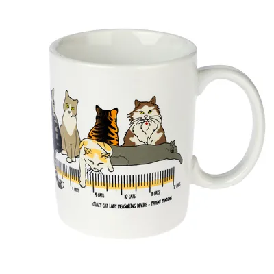 Tazza bianca con illustrazioni di gatti e scala da 1 a 12 gatti. Testo: "Crazy Cat Lady Measuring Device - Patent Pending".
