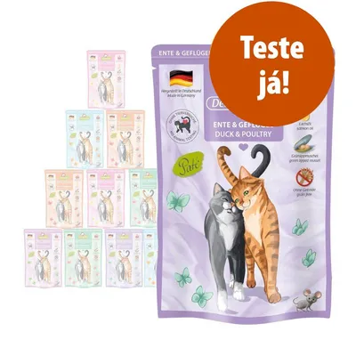 Embalagem de comida húmida para gatos, marca com texto visível: 'Ente & Geflügel', 'Duck & Poultry', 'Paté', 'Ohne Getreide', 'Teste já!'. Ilustração de dois gatos na frente.