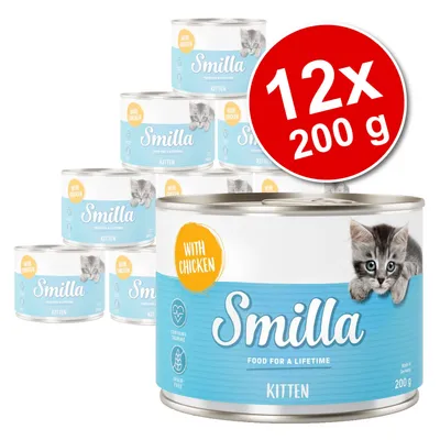 Lot de 12 boîtes Smilla Kitten 200 g, avec mention 'With Chicken', image de chaton sur l’étiquette, texte visible : 'FOOD FOR A LIFETIME', 'CONTAINS TAURINE', 'GRAIN-FREE'.