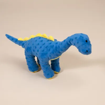 Weiches blaues Dinosaurier-Plüschtier mit gelben Zacken auf dem Rücken, geeignet als Spielzeug.