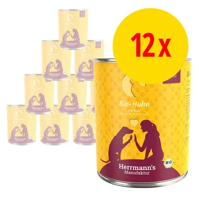 Lot de 12 boîtes Herrmann's Manufaktur Bio-Huhn mit Reis, texte visible : Organic chicken with rice, illustration chien et personne, label Bio. Lot de 12 boîtes Herrmann's Manufaktur Bio-Huhn mit Reis, texte visible : Organic chicken with rice, illustration chien et personne, label Bio.