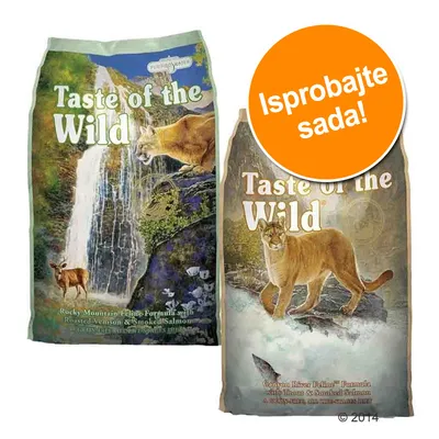 Dva pakiranja Taste of the Wild hrane za mačke, vidljivi natpisi: 'Rocky Mountain Feline Formula with Roasted Venison & Smoked Salmon' i 'Canyon River Feline Formula with Trout & Smoked Salmon'. Narančasti krug s tekstom 'Isprobajte sada!'.