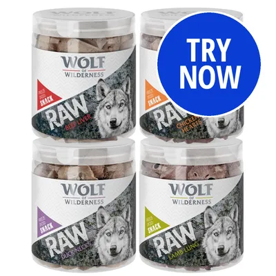 Four tubs of freeze-dried snack labelled RAW: beef liver, chicken hearts, duck necks, and lamb lung. Blue circle with white text reads TRY NOW.