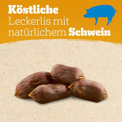 Köstliche Leckerlis mit natürlichem Schwein. Vier braune Snacks auf beigem Hintergrund, Text und blaues Schweine-Icon sichtbar.