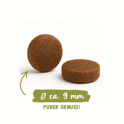 Zwei runde Futterstücke, Durchmesser ca. 9 mm. Text: PURER GENUSS!