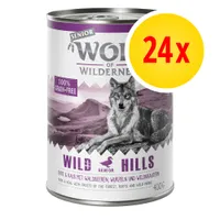 Wolf of Wilderness Senior Wild Hills 400 g koiran märkäruoka, 100 % grain-free, 24x monipakkaus. Etiketissä susi ja vuoristomaisema. Teksti englanniksi ja saksaksi.