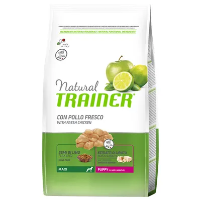 Natural Trainer hondenvoer, con pollo fresco (met verse kip), semi di lino, estratti di lievito, maxi, puppy 2–8 maanden. Afbeeldingen van appel, limoen, kip, lijnzaad en gist.