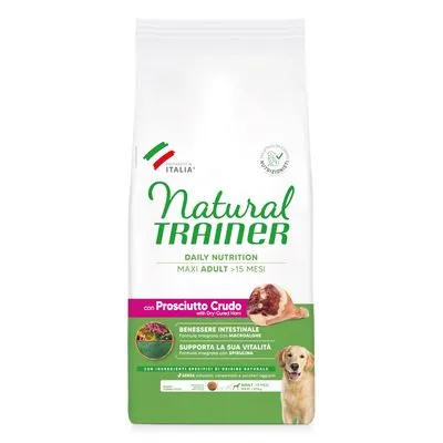 Natural Trainer Daily Nutrition Maxi Adult >15 mesi con Prosciutto Crudo. Benessere intestinale, supporta la vitalità. Met zichtbaar stuk ham en afbeelding van een hond op de verpakking.