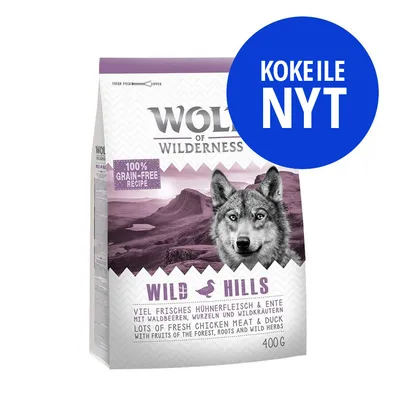 Wolf of Wilderness Wild Hills 400 g, 100% grain-free recipe, lots of fresh chicken meat & duck, kokeile nyt -teksti sinisessä ympyrässä pakkauksen päällä