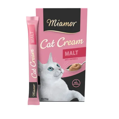 Miamor Cat Cream Malt Anti-Hairball, boîte de 6x15g, texte visible : + Malzextrakt, image d’un chat blanc et d’une cuillère avec crème, emballage rose et noir.