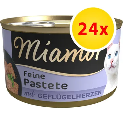 Miamor Feine Pastete mit Geflügelherzen, confezione da 24x. Testo in tedesco sull'etichetta e immagine di un gatto bianco con occhi azzurri visibile sulla confezione.