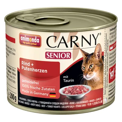 Boîte de pâtée pour chat Animonda Carny Senior, Rind + Putenherzen, sans céréales, 100 % fraîches ingrédients, Made in Germany, avec taurine, 200 g. Image d’un chat et d’une gamelle.