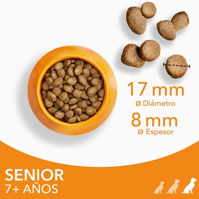 Pienso para perros senior 7+ años, croquetas de 17 mm diámetro y 8 mm espesor, mostrado en cuenco naranja y detalle del tamaño de las croquetas.