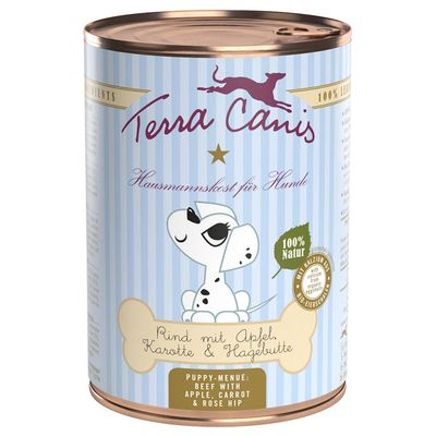 Lata de comida para perros Terra Canis. Texto visible: 'Rind mit Apfel, Karotte & Hagebutte', 'Puppy-Menu: Beef with apple, carrot & rose hip', '100 % Natur'.
