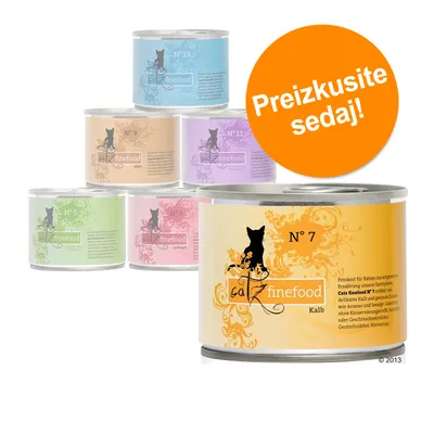 Več pločevink mačje hrane catz finefood, različne številke in barve: N° 3, N° 5, N° 7, N° 9, N° 11, N° 13. Oranžni krog z besedilom: Preizkusite sedaj!