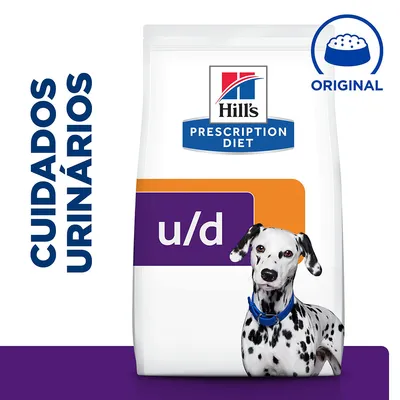 Embalagem de Hill's Prescription Diet u/d com texto visível: 'CUIDADOS URINÁRIOS' e símbolo 'ORIGINAL' ao lado de um cão dálmata sentado à frente do saco. Embalagem de Hill's Prescription Diet u/d com texto visível: 'CUIDADOS URINÁRIOS' e símbolo 'ORIGINAL' ao lado de um cão dálmata sentado à frente do saco.