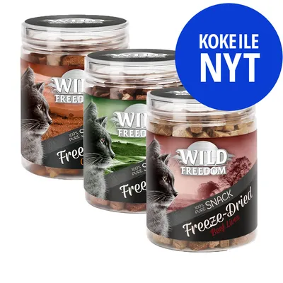 Kolme Wild Freedom Freeze-Dried -kissanherkkupurkkia, etiketissä teksti '100% pure snack' ja 'Beef Liver'. Sininen ympyrä: KOKEILE NYT.