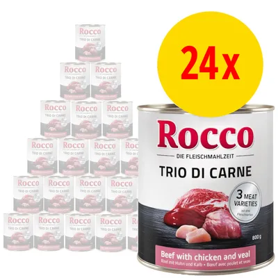 Rocco Trio di Carne våtfoder, 24x800 g. Synlig text: '3 meat varieties', 'Beef with chicken and veal'. Bild på köttbitar och staplade burkar i bakgrunden.