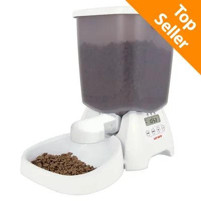 Distributore automatico Cat Mate per crocchette, display digitale con orario 10:53, pulsanti di controllo visibili. Etichetta arancione in alto a destra: Top Seller. Distributore automatico Cat Mate per crocchette, display digitale con orario 10:53, pulsanti di controllo visibili. Etichetta arancione in alto a destra: Top Seller.