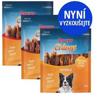 Balíčky Rocco Chings Double, nápisy: Double meat & pleasure!, CHICKEN WITH LIVER, 200 g. Modrý kruh s textem NYNÍ VYZKOUŠEJTE. Balíčky Rocco Chings Double, nápisy: Double meat & pleasure!, CHICKEN WITH LIVER, 200 g. Modrý kruh s textem NYNÍ VYZKOUŠEJTE.