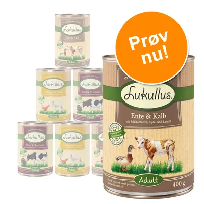 Lukullus dåsefoder til hund, varianter: Ente & Kalb, Geflügel & Lamm, Rind & Truthahn. Stor orange cirkel med teksten 'Prøv nu!'. 400 g pr. dåse. Adult.