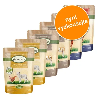 Sada kapsiček Lukullus 300 g s různými příchutěmi, viditelné texty: Geflügel & Lamm, nyní vyzkoušejte. Obaly zobrazují zvířata a zelenou trávu.