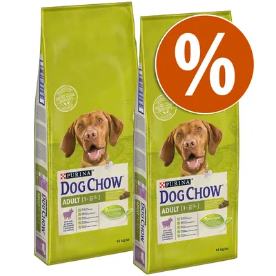 2 sacos de Purina Dog Chow Adult con cordero, cada uno de 14 kg. Etiqueta verde, imagen de perro y símbolo de porcentaje en círculo naranja indicando oferta.