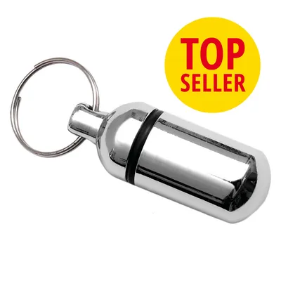 Porte-clés capsule métallique avec anneau, texte visible : TOP SELLER sur fond jaune.