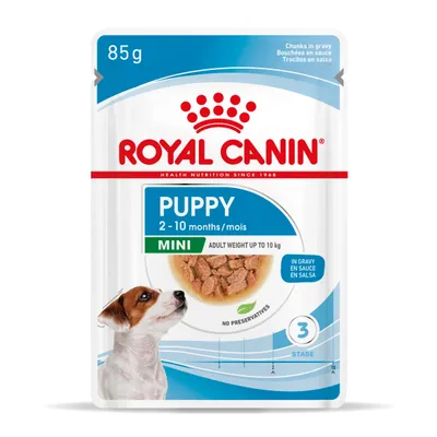 Royal Canin Puppy Mini 85 g, dla szczeniąt 2–10 miesięcy, masa docelowa do 10 kg, kawałki w sosie, bez konserwantów. Widoczny pies i miska z karmą.