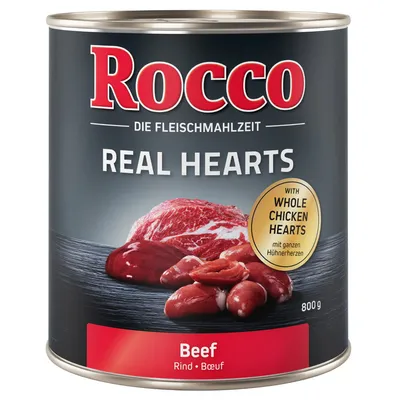 Консерва Rocco Real Hearts Beef 800 г, с надпис 'WITH WHOLE CHICKEN HEARTS'. Видими парчета месо и сърца на етикета. Текстът е на английски и немски.