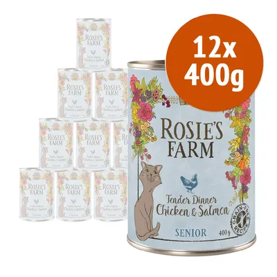 12 lattine da 400 g ciascuna di Rosie's Farm Tender Dinner Chicken & Salmon Senior, confezione visibile con illustrazione di gatto e fiori, scritta 'grain-free recipe' sulla lattina. 12 lattine da 400 g ciascuna di Rosie's Farm Tender Dinner Chicken & Salmon Senior, confezione visibile con illustrazione di gatto e fiori, scritta 'grain-free recipe' sulla lattina.
