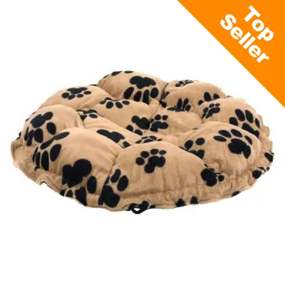 Okrúhly béžový pelech s čiernymi odtlačkami labiek, text v rohu: Top Seller