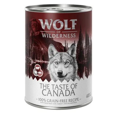 400g can labelled 'The Taste of Canada', 100% grain-free recipe with fresh beef, cod, turkey and cranberries. Wolf of Wilderness branding visible.